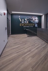 Future Spartans walk into the recruitment center on porcelain wood-look tile, installed with TEC® Full Flex®.